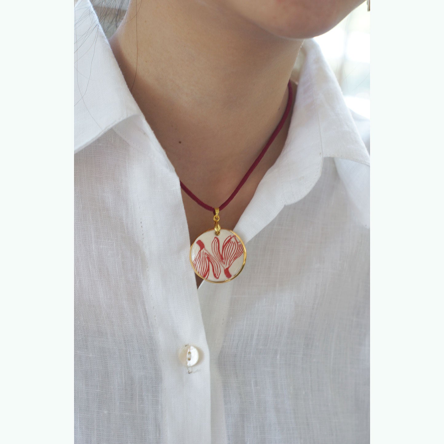 Set of Jumpa illustration pendant gold rim painted and hanging circle earrings