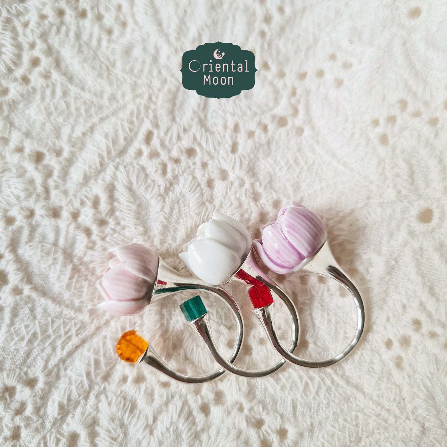 Adjustable lotus bud porcelain ring with a dice crystal bead