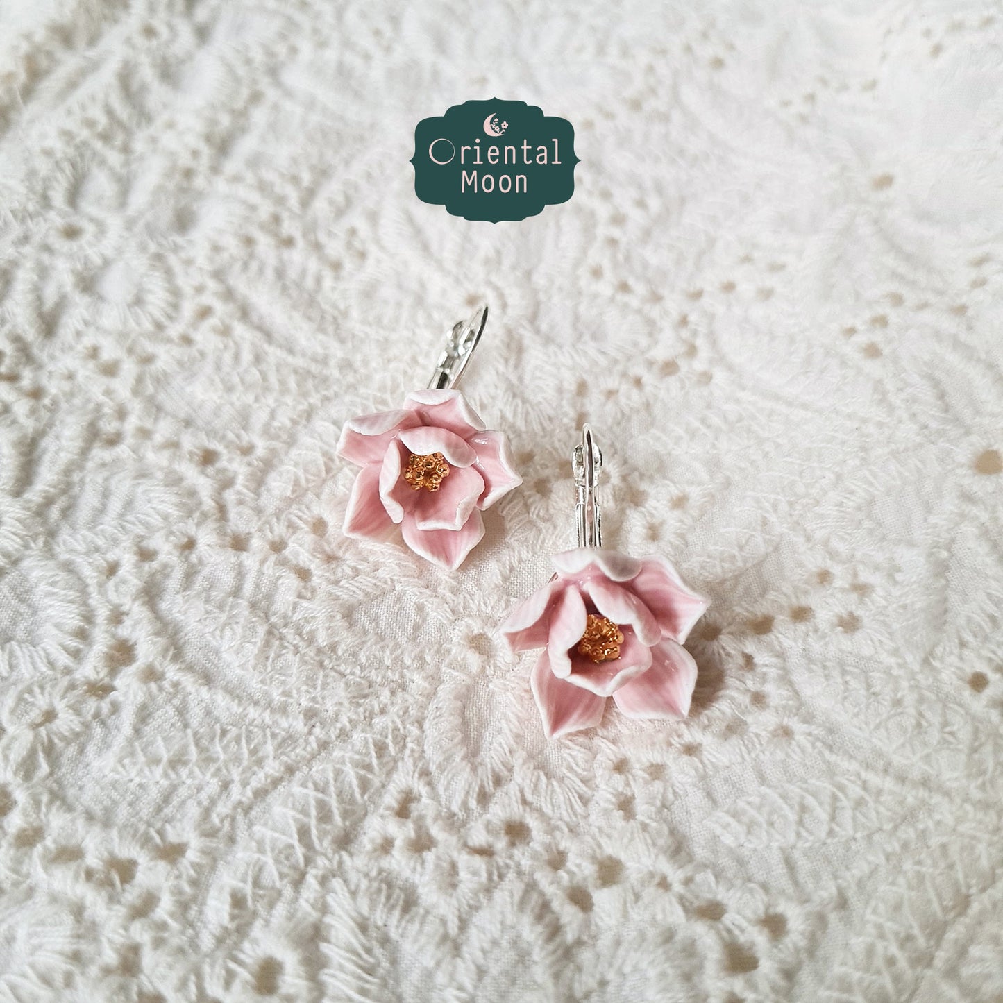 Lotus porcelain hanging earrings with a 925 sterling silver circular base