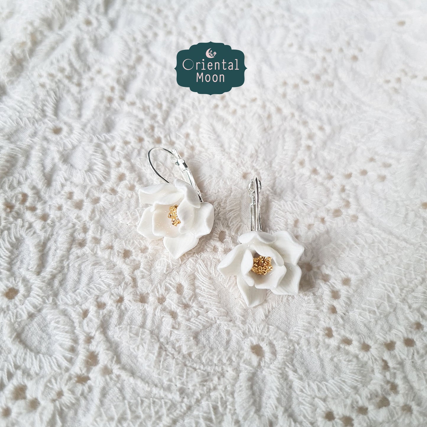 Lotus porcelain hanging earrings with a 925 sterling silver circular base