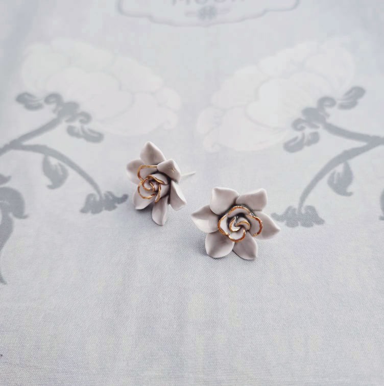 Dok Pud Son Porcelain stud earrings with 925 sterling silver posts.