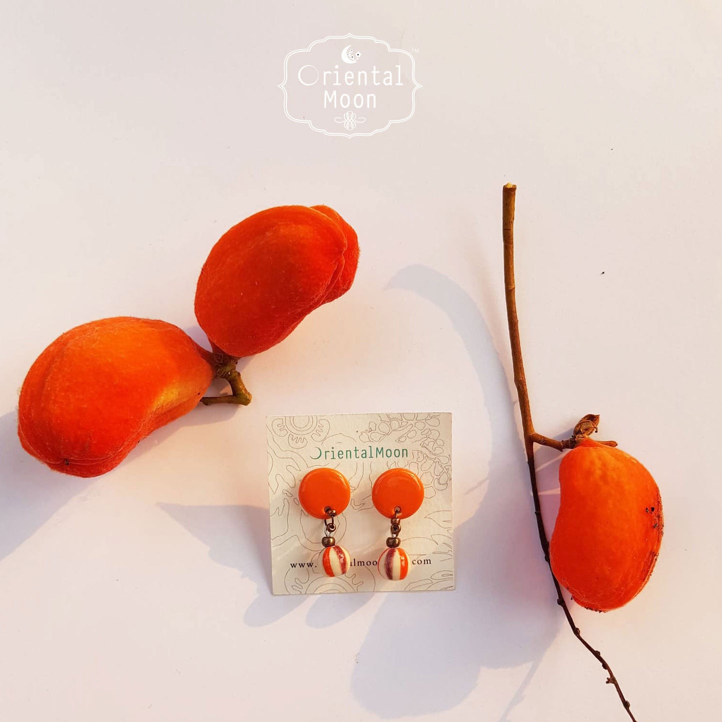 Ceramic drop earrings decorated with striped color ball ต่างหูเซรามิคสีเรียบประดับตุ้งติ้งบอลเพ้นท์ลายทาง