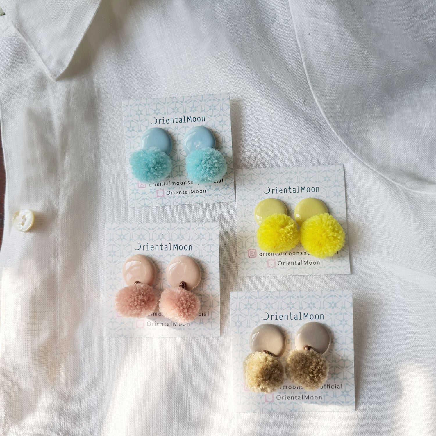 Pom Pom decorated earrings
