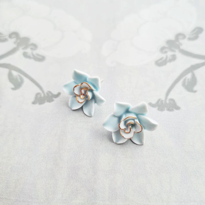 Dok Pud Son Porcelain stud earrings with 925 sterling silver posts.