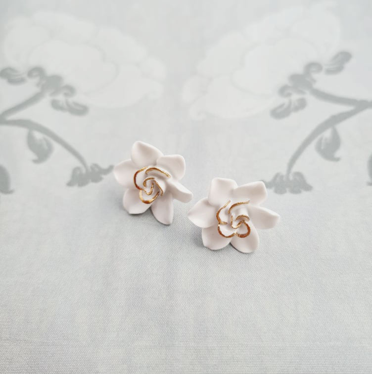 Dok Pud Son Porcelain stud earrings with 925 sterling silver posts.